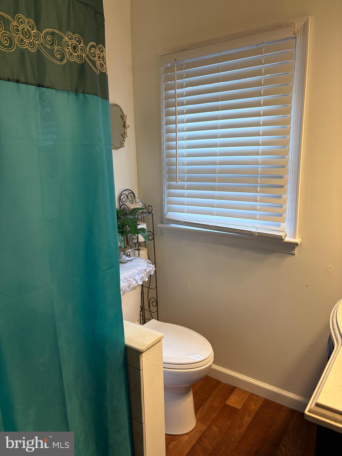 7404 Wyndam Road Pennsauken, NJ 08110 - Photo 36 of 50 a white toilet sitting next to a small window