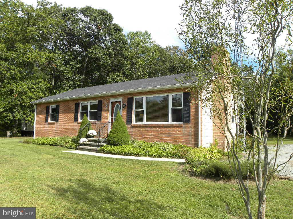 2414 Busic Church Road Marydel, MD 21649 - Photo 1 of 30 a front view of house with yard and green space
