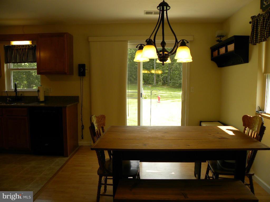 2414 Busic Church Road Marydel, MD 21649 - Photo 14 of 30 a dining room with furniture and window