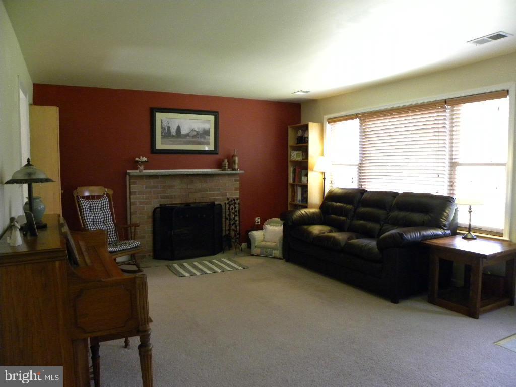 2414 Busic Church Road Marydel, MD 21649 - Photo 15 of 30 a living room with furniture and a fireplace