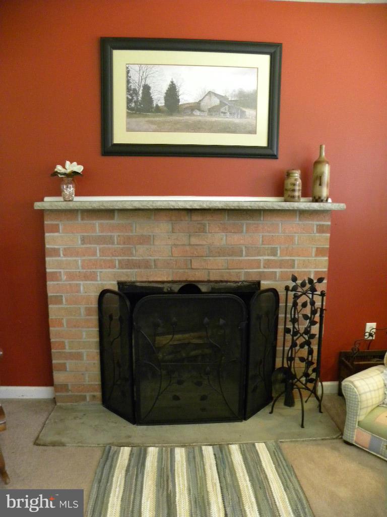 2414 Busic Church Road Marydel, MD 21649 - Photo 17 of 30 a living room with furniture and a fireplace