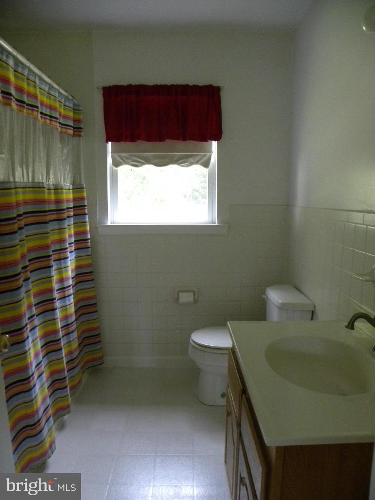 2414 Busic Church Road Marydel, MD 21649 - Photo 23 of 30 a bathroom with a sink and a toilet