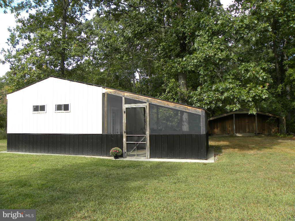 2414 Busic Church Road Marydel, MD 21649 - Photo 24 of 30 a front view of a house with garden