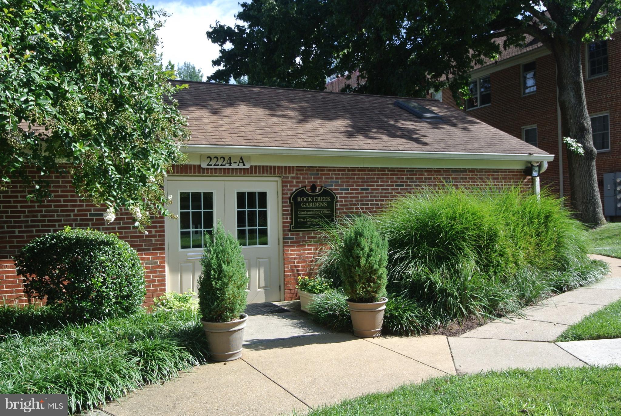 8201 Grubb Road, Unit 101 Silver Spring, MD 20910 - Photo 21 of 31 a view of a house with yard and plants