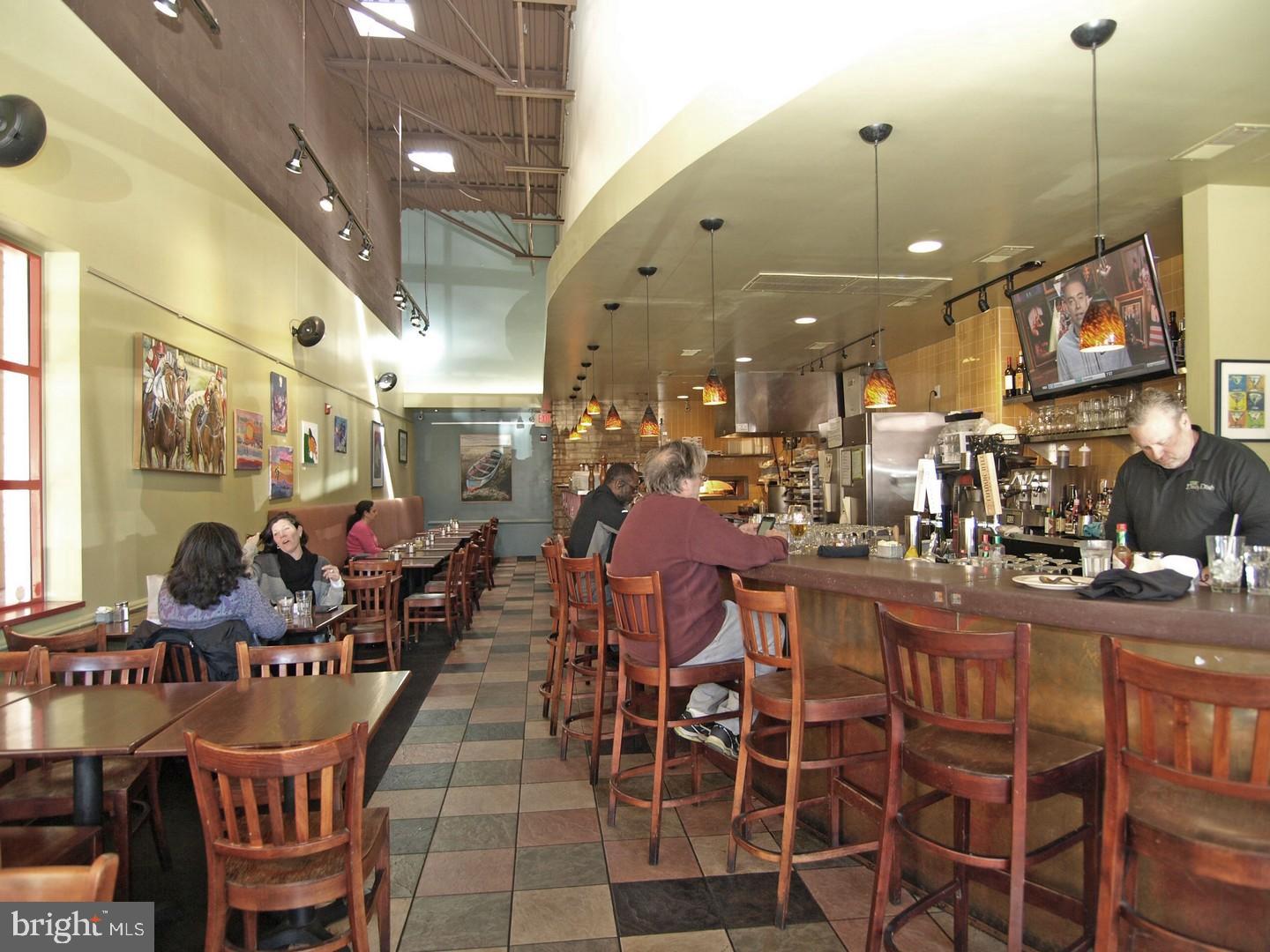 8201 Grubb Road, Unit 101 Silver Spring, MD 20910 - Photo 25 of 31 a outdoor dining area with lots of tables and chairs