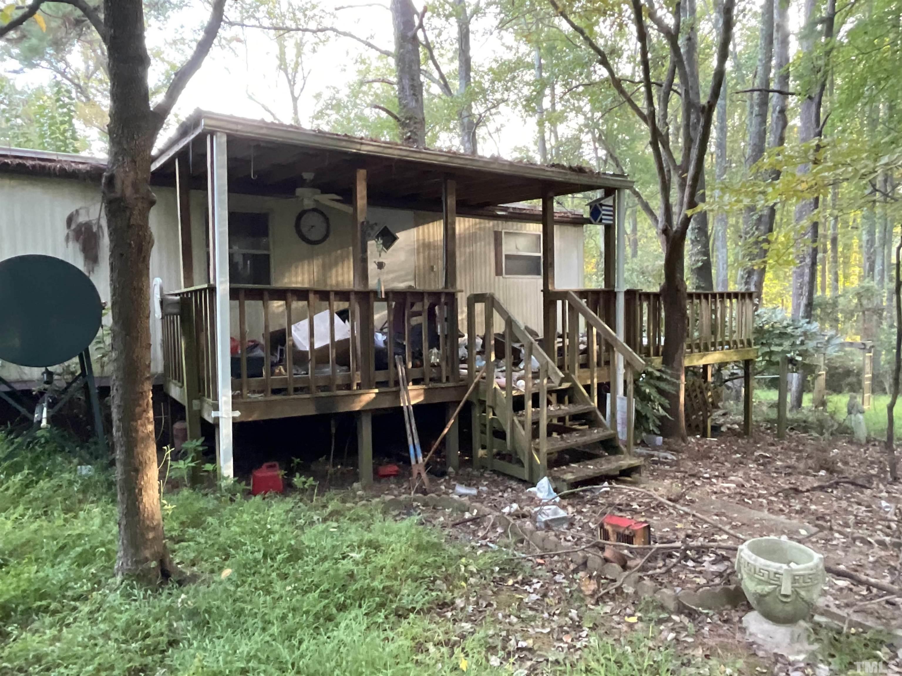 8229 Holly Springs Road Raleigh, NC 27606 - Photo 11 of 24 a view of a chairs and table in backyard