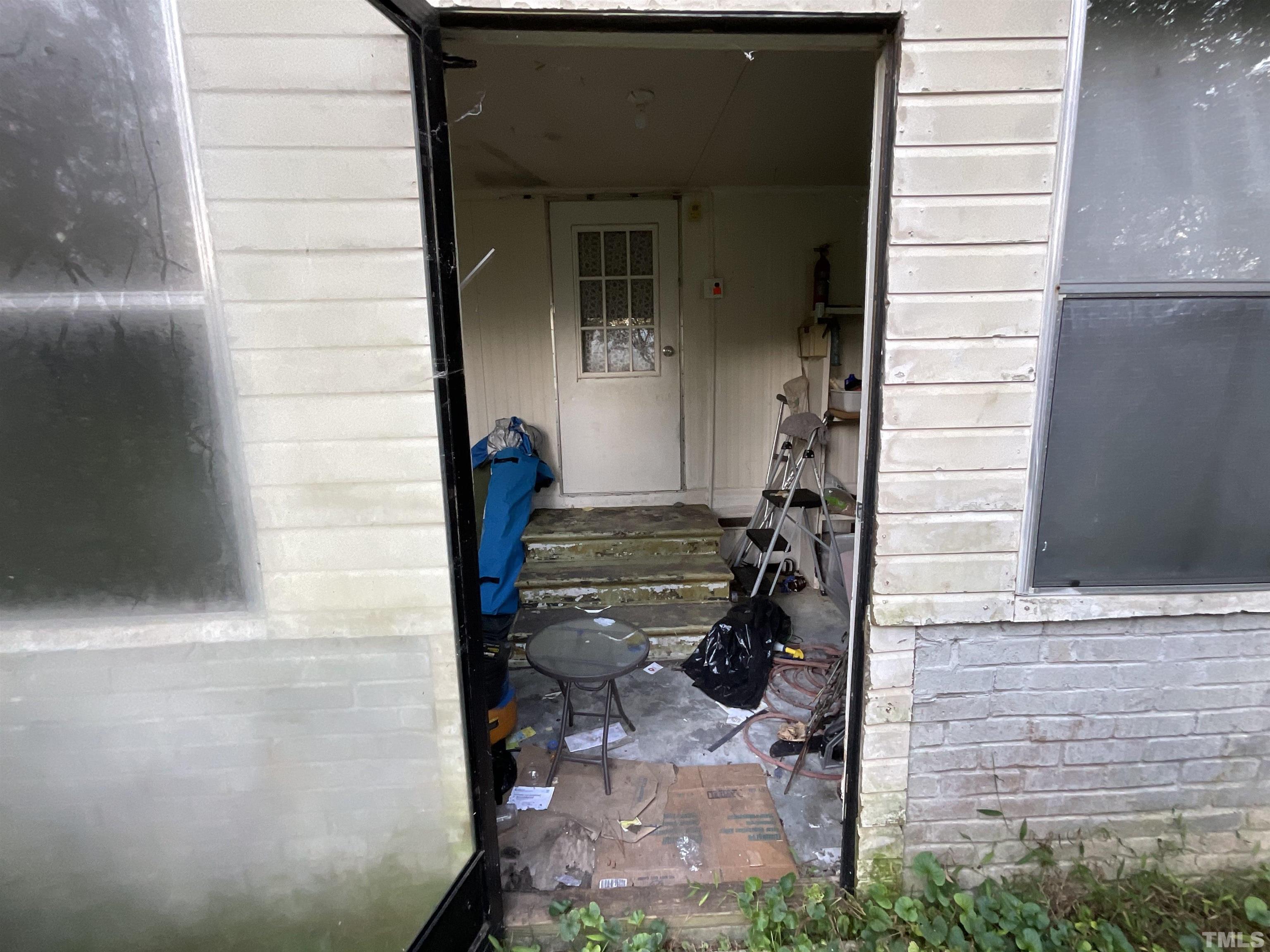 8229 Holly Springs Road Raleigh, NC 27606 - Photo 17 of 24 a view of entryway front of house