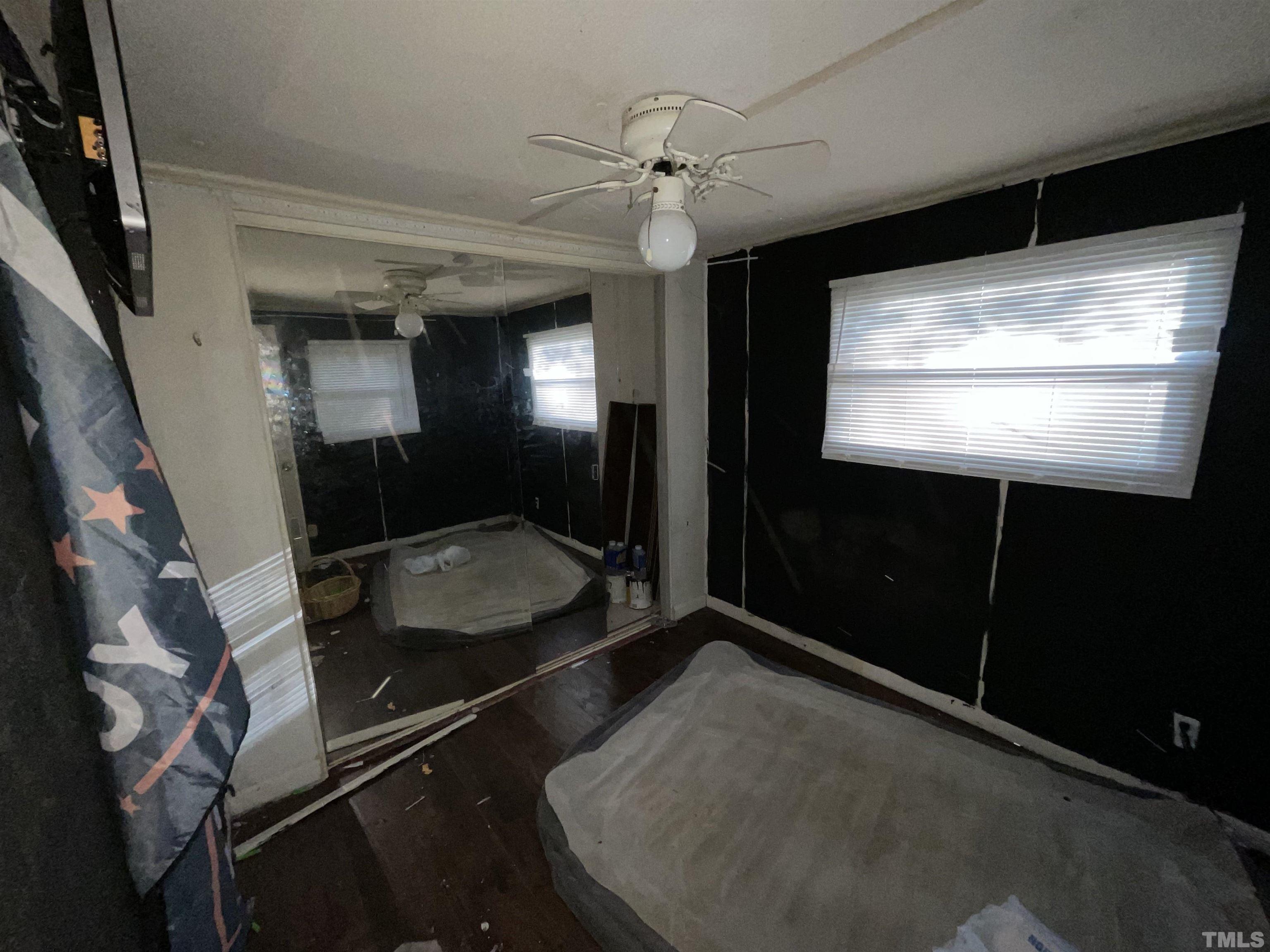 8229 Holly Springs Road Raleigh, NC 27606 - Photo 19 of 24 a bathroom with a sink and mirror
