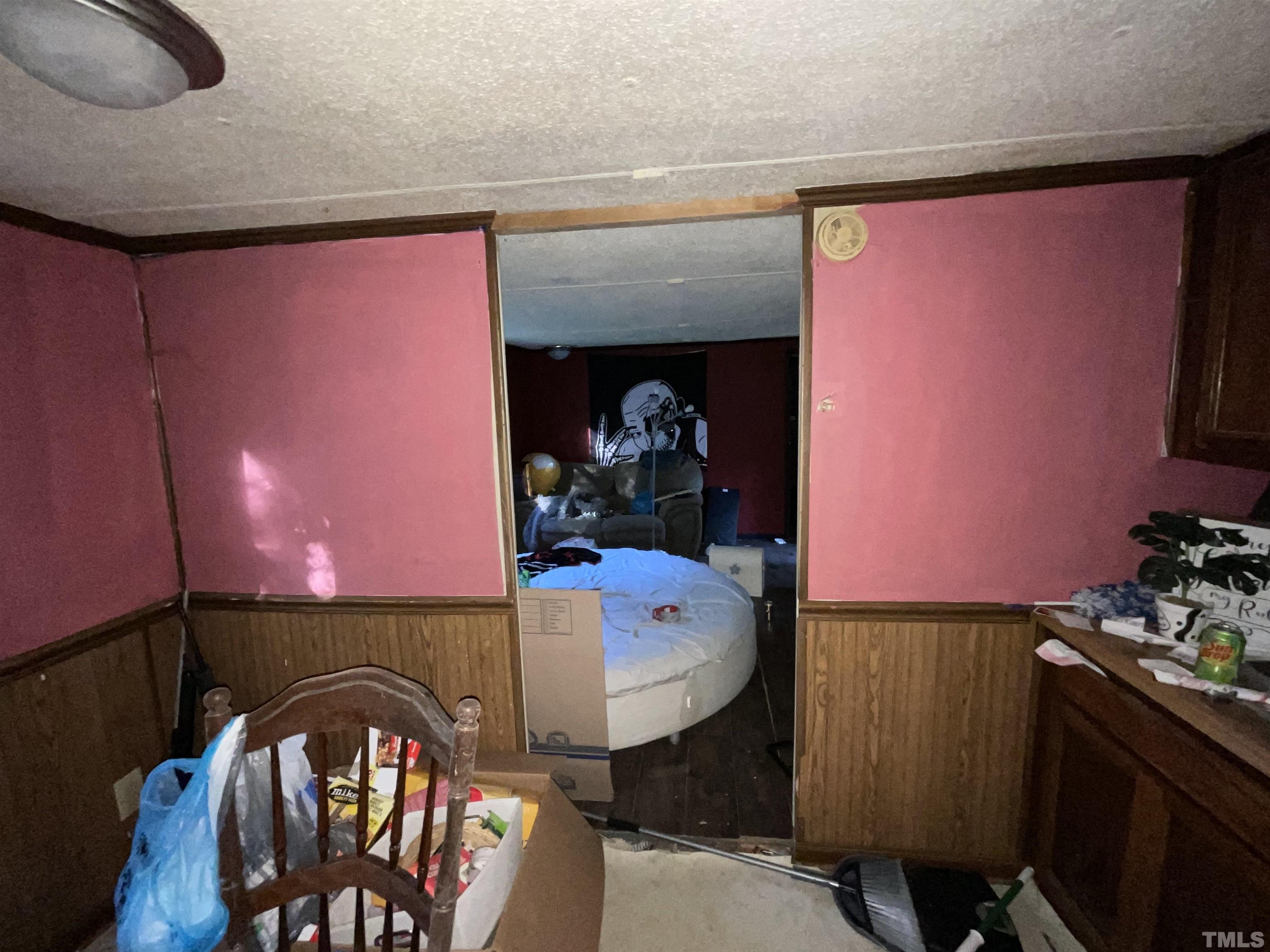8229 Holly Springs Road Raleigh, NC 27606 - Photo 22 of 24 a bathroom with a sink a mirror and a toilet