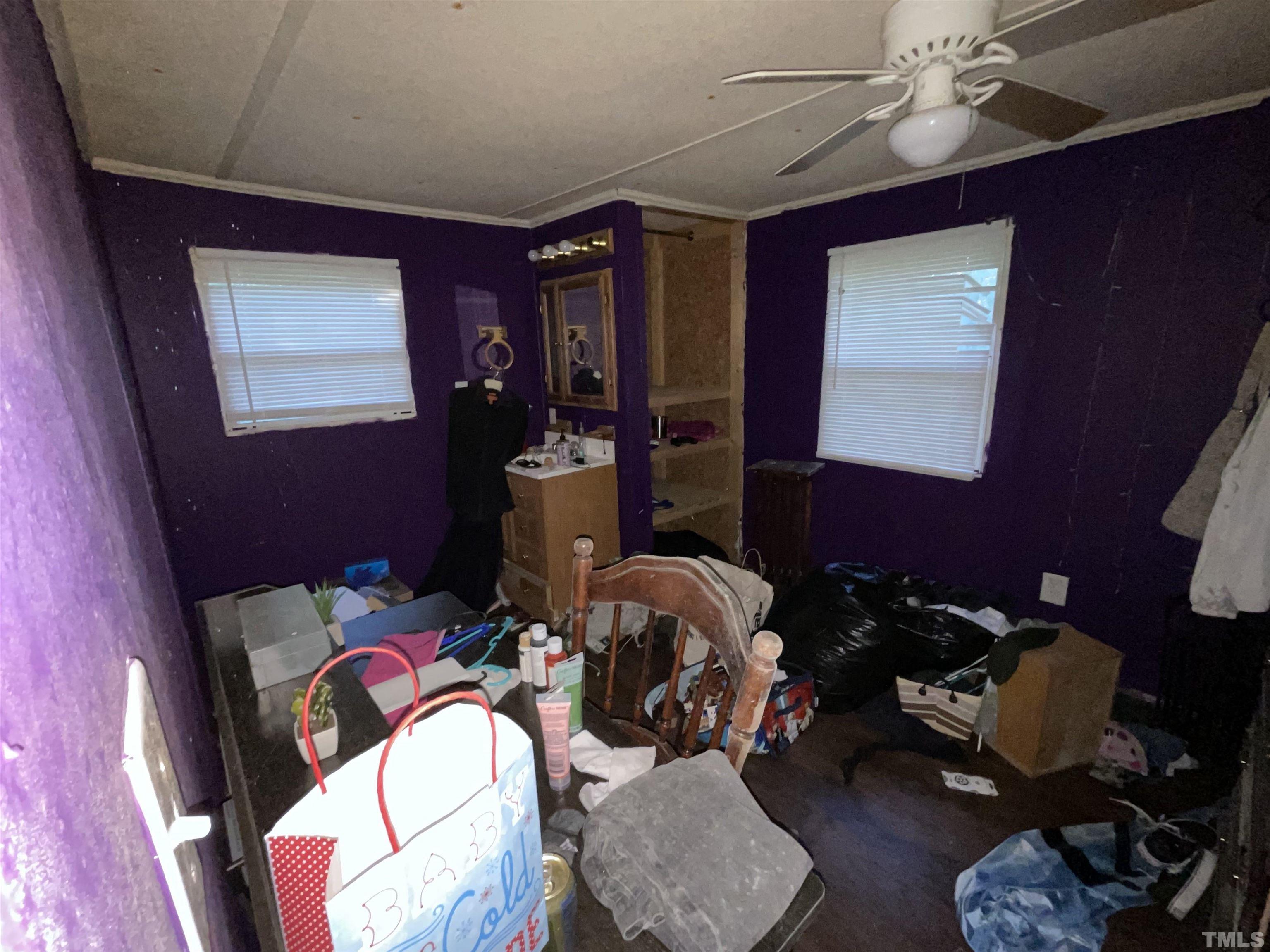 8229 Holly Springs Road Raleigh, NC 27606 - Photo 24 of 24 a living room with furniture and wooden floor