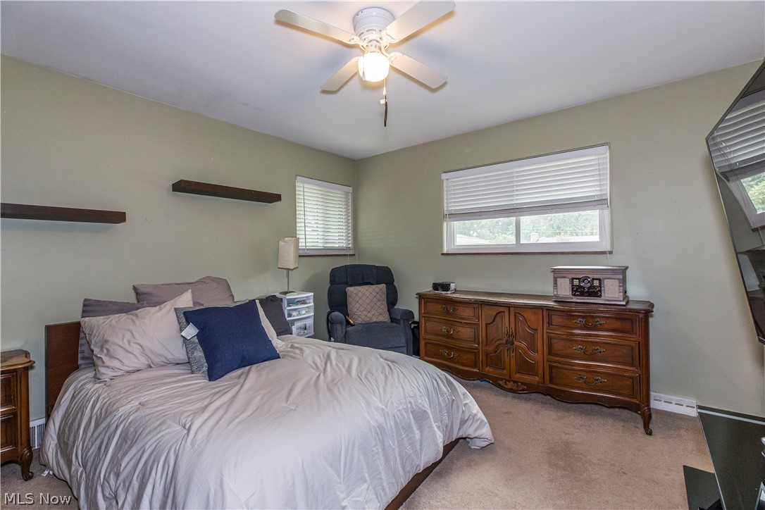 2095 Wyndham Road Akron, OH 44313 - Photo 18 of 40 Carpeted bedroom with ceiling fan