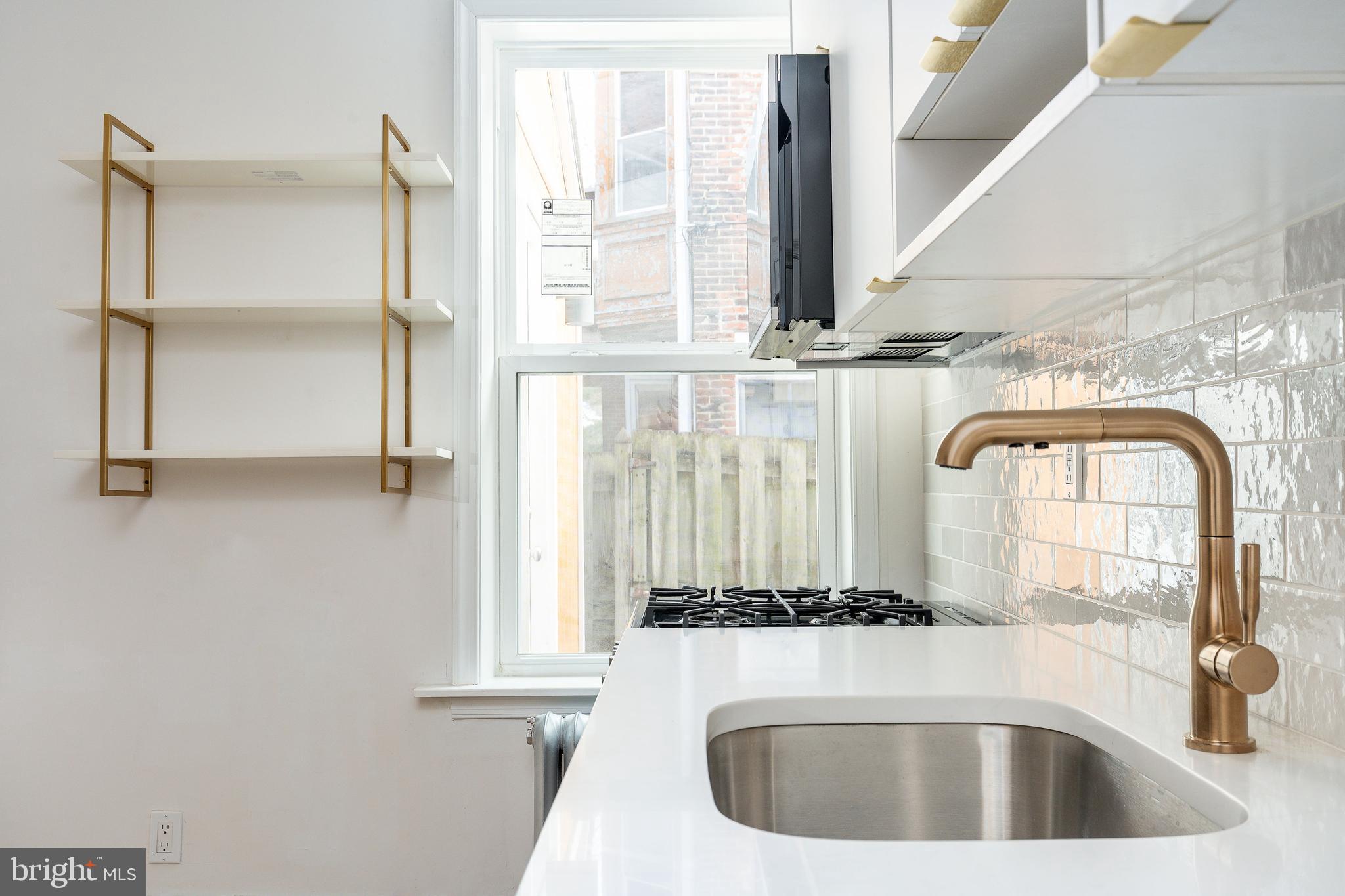 2143 Palethorp Street Philadelphia, PA 19122 - Photo 6 of 27 a bathroom with a sink and a mirror