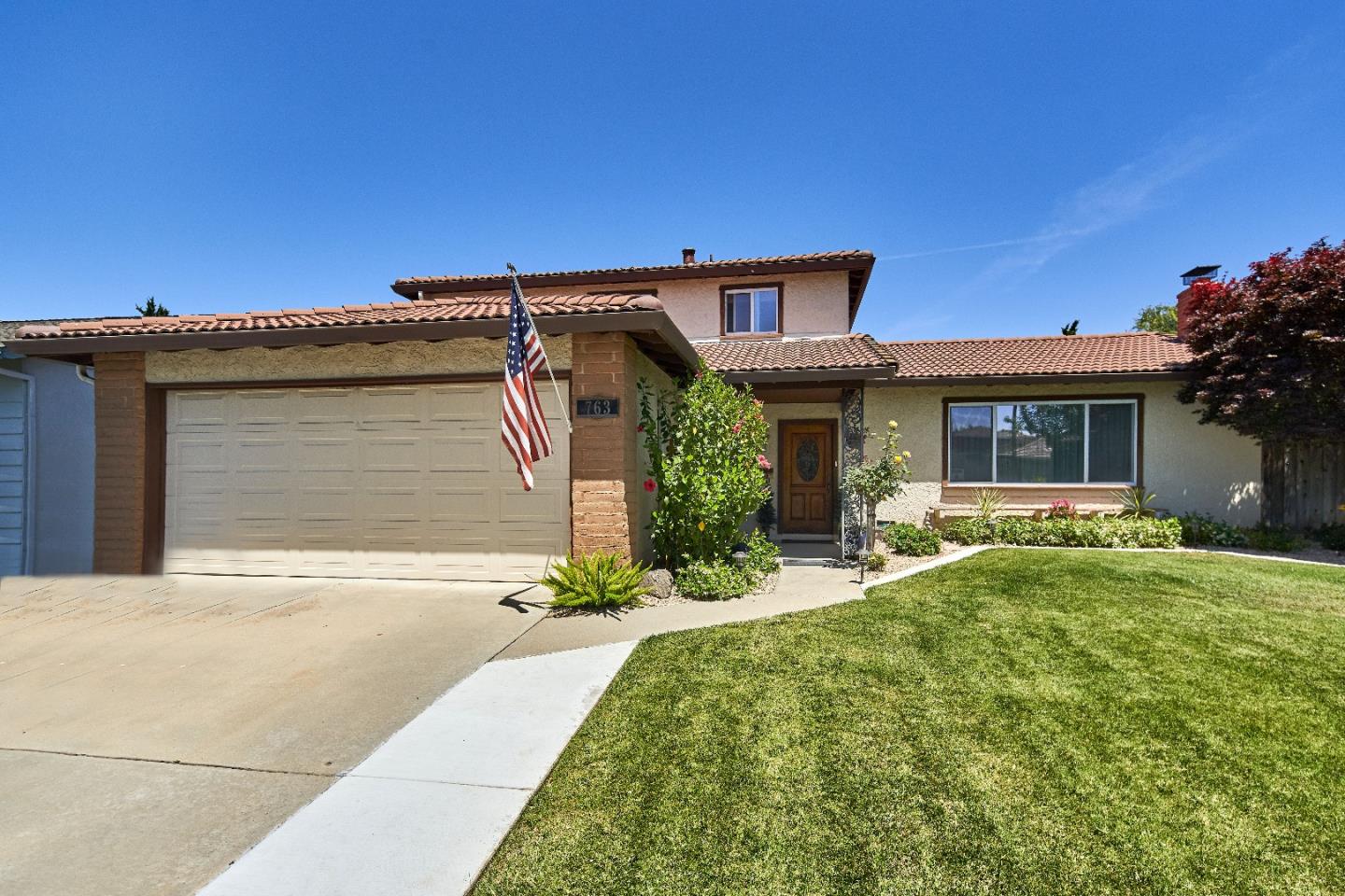 763 Upton Way San Jose, CA 95136 - Photo 1 of 32 a front view of a house with a yard and garage