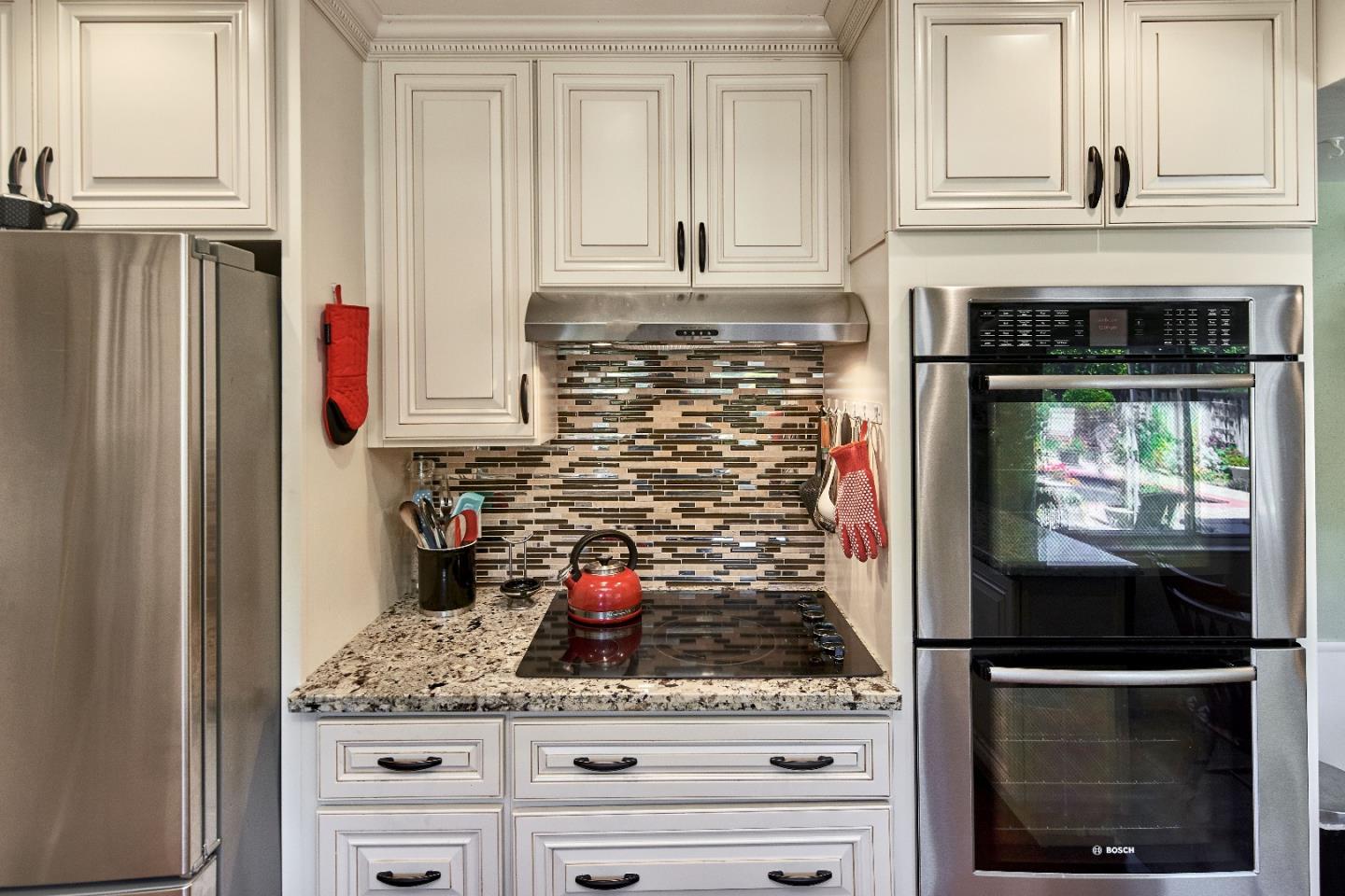 763 Upton Way San Jose, CA 95136 - Photo 11 of 32 a kitchen with stainless steel appliances granite countertop a stove and a microwave