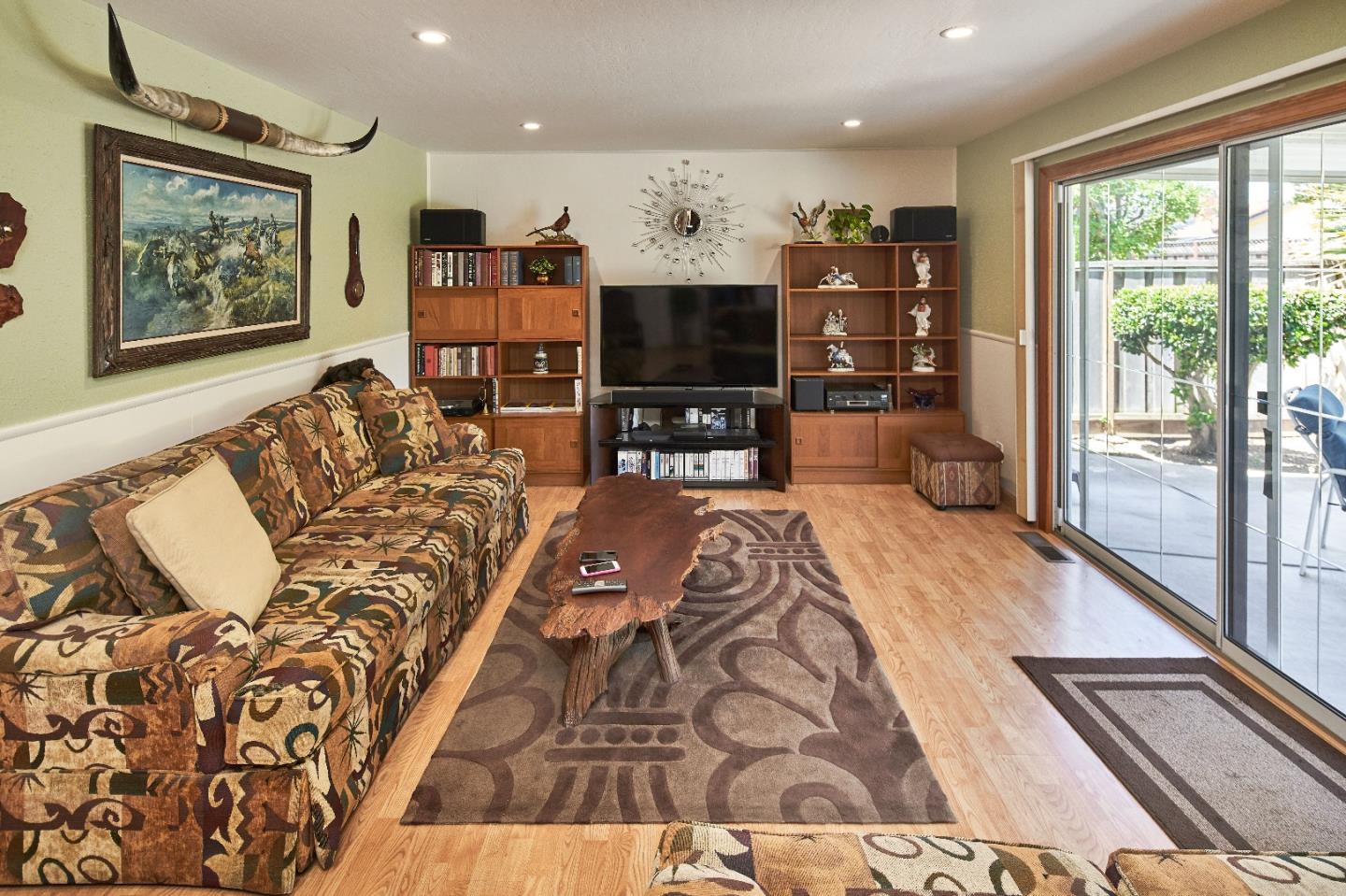 763 Upton Way San Jose, CA 95136 - Photo 14 of 32 a living room with furniture and a flat screen tv