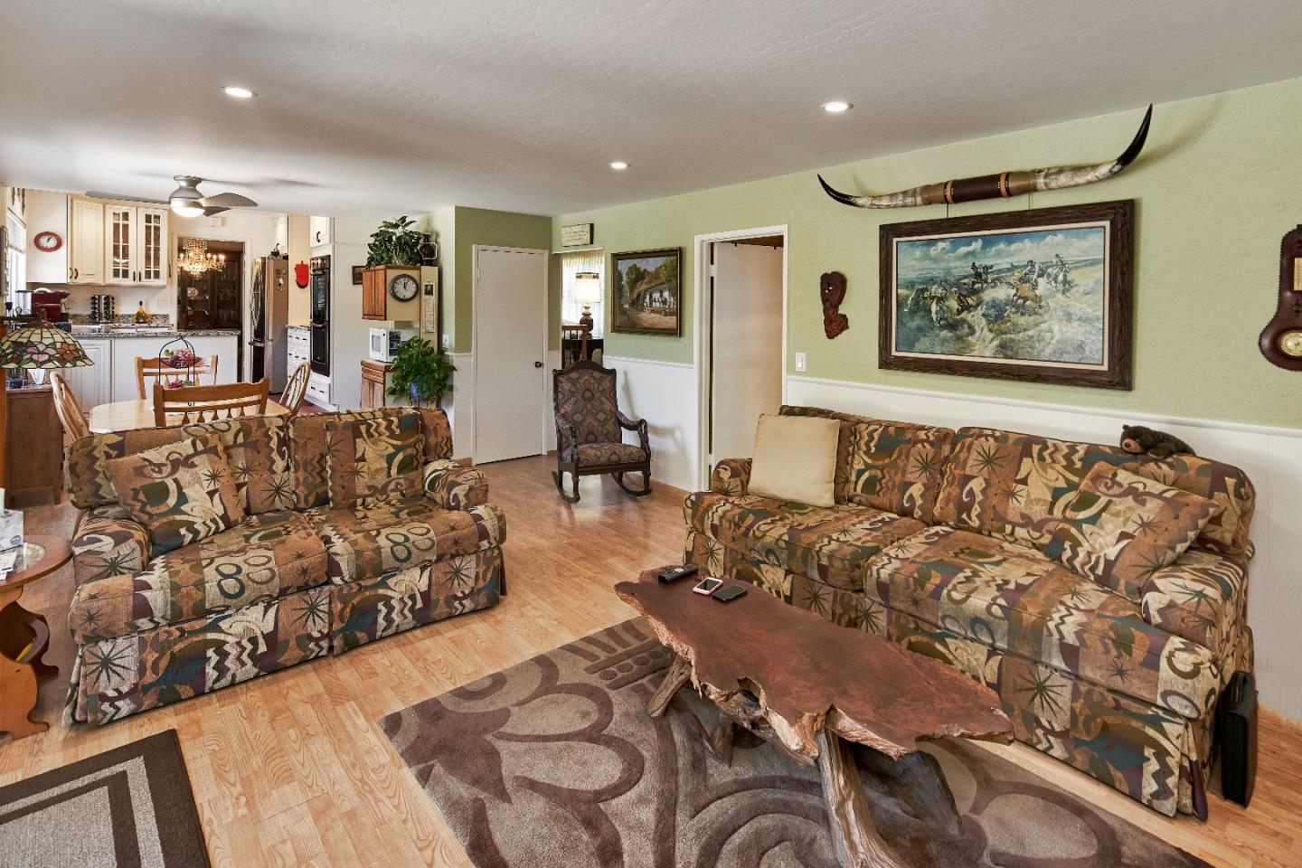 763 Upton Way San Jose, CA 95136 - Photo 15 of 32 a living room with furniture and wall paintings