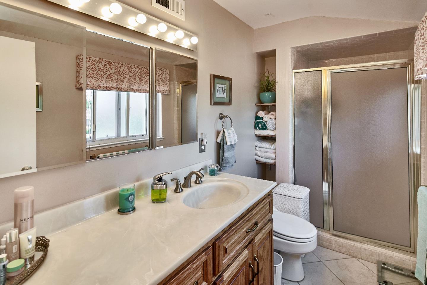 763 Upton Way San Jose, CA 95136 - Photo 22 of 32 a bathroom with a sink toilet and shower