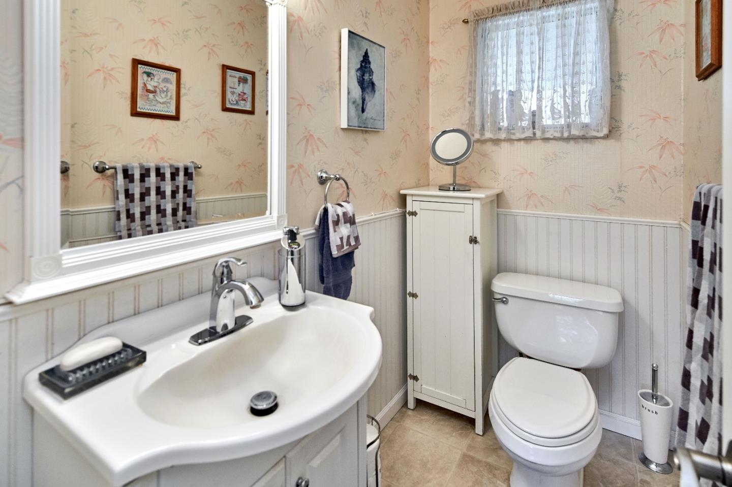 763 Upton Way San Jose, CA 95136 - Photo 25 of 32 a bathroom with a sink a toilet and a mirror