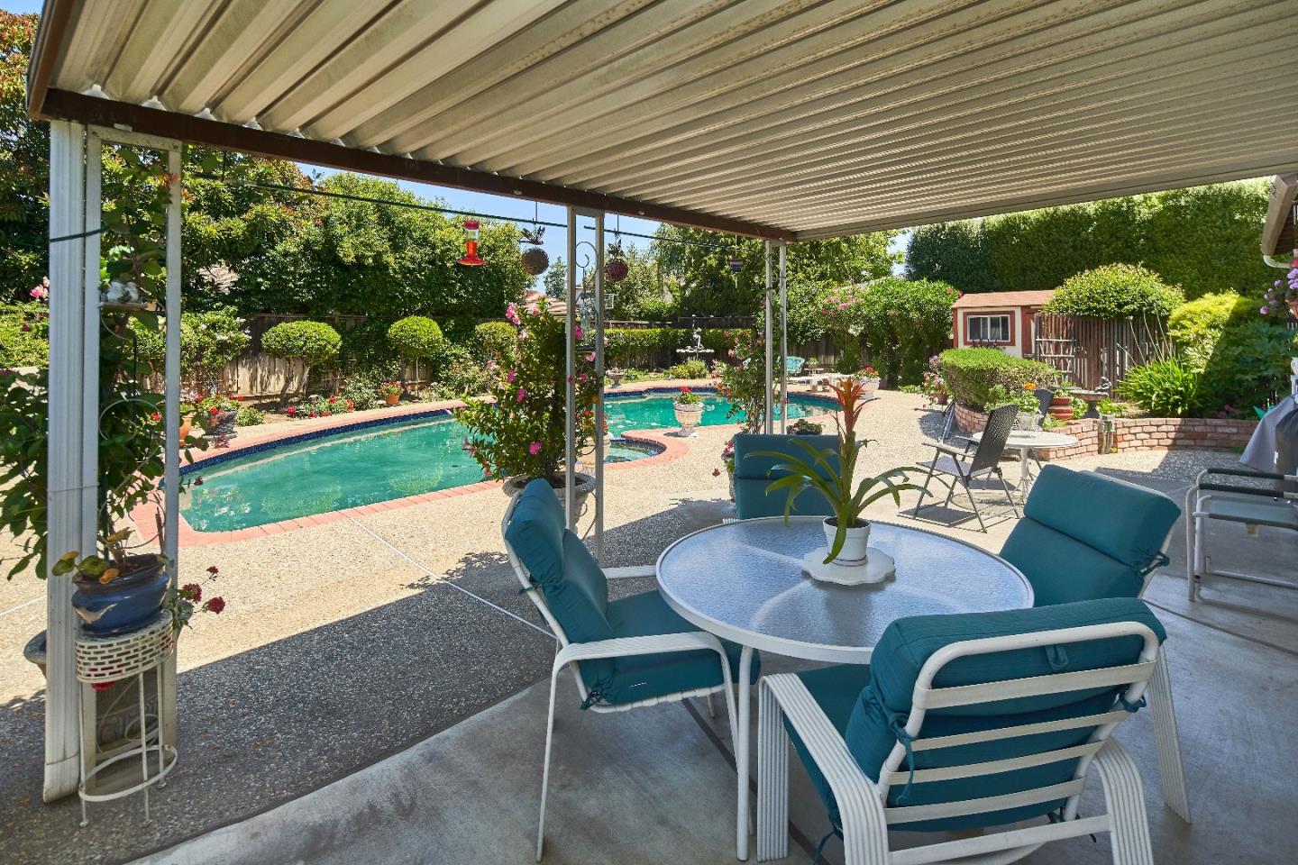 763 Upton Way San Jose, CA 95136 - Photo 26 of 32 a view of a patio with a table chairs and a backyard