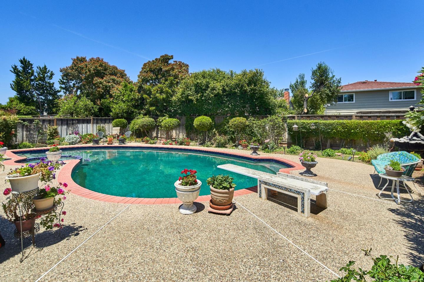 763 Upton Way San Jose, CA 95136 - Photo 30 of 32 a roof deck with table and chairs a fire pit