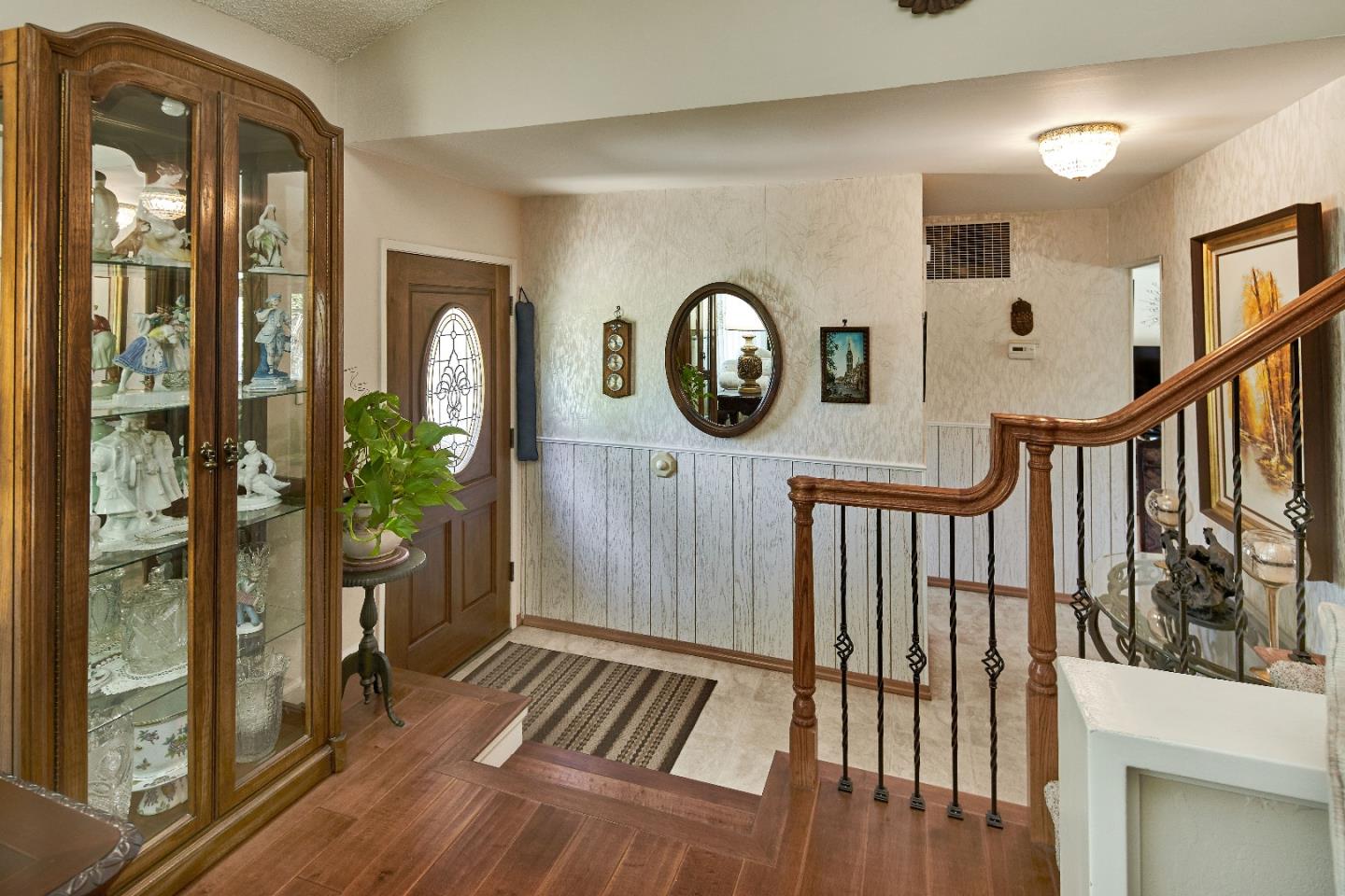 763 Upton Way San Jose, CA 95136 - Photo 4 of 32 a view of a hallway with wooden floor