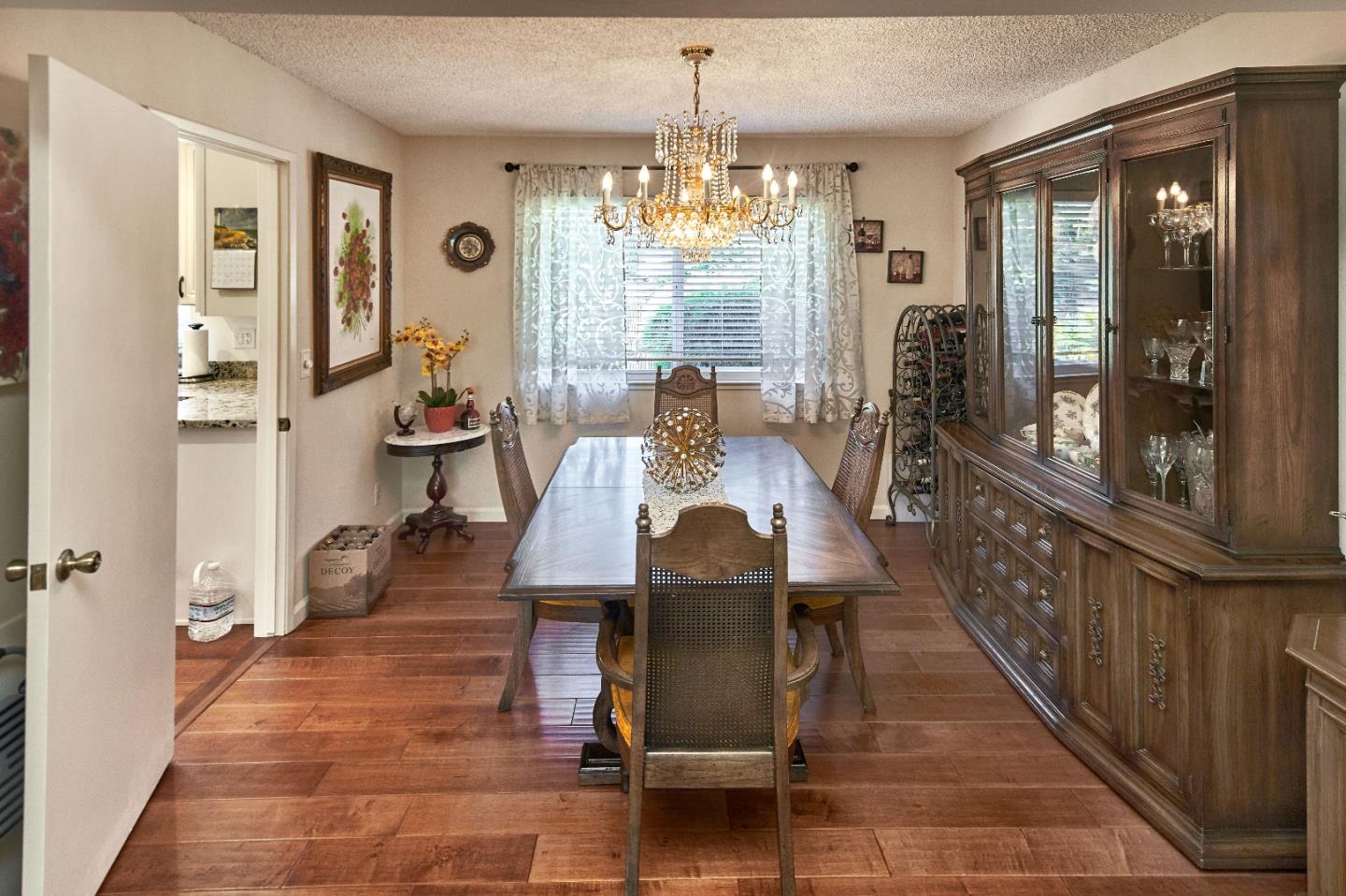 763 Upton Way San Jose, CA 95136 - Photo 8 of 32 a view of a dining room with furniture window and wooden floor