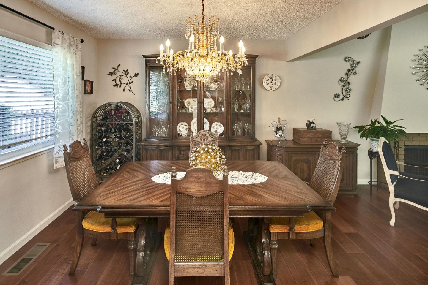 763 Upton Way San Jose, CA 95136 - Photo 9 of 32 a view of a dining room with furniture and wooden floor