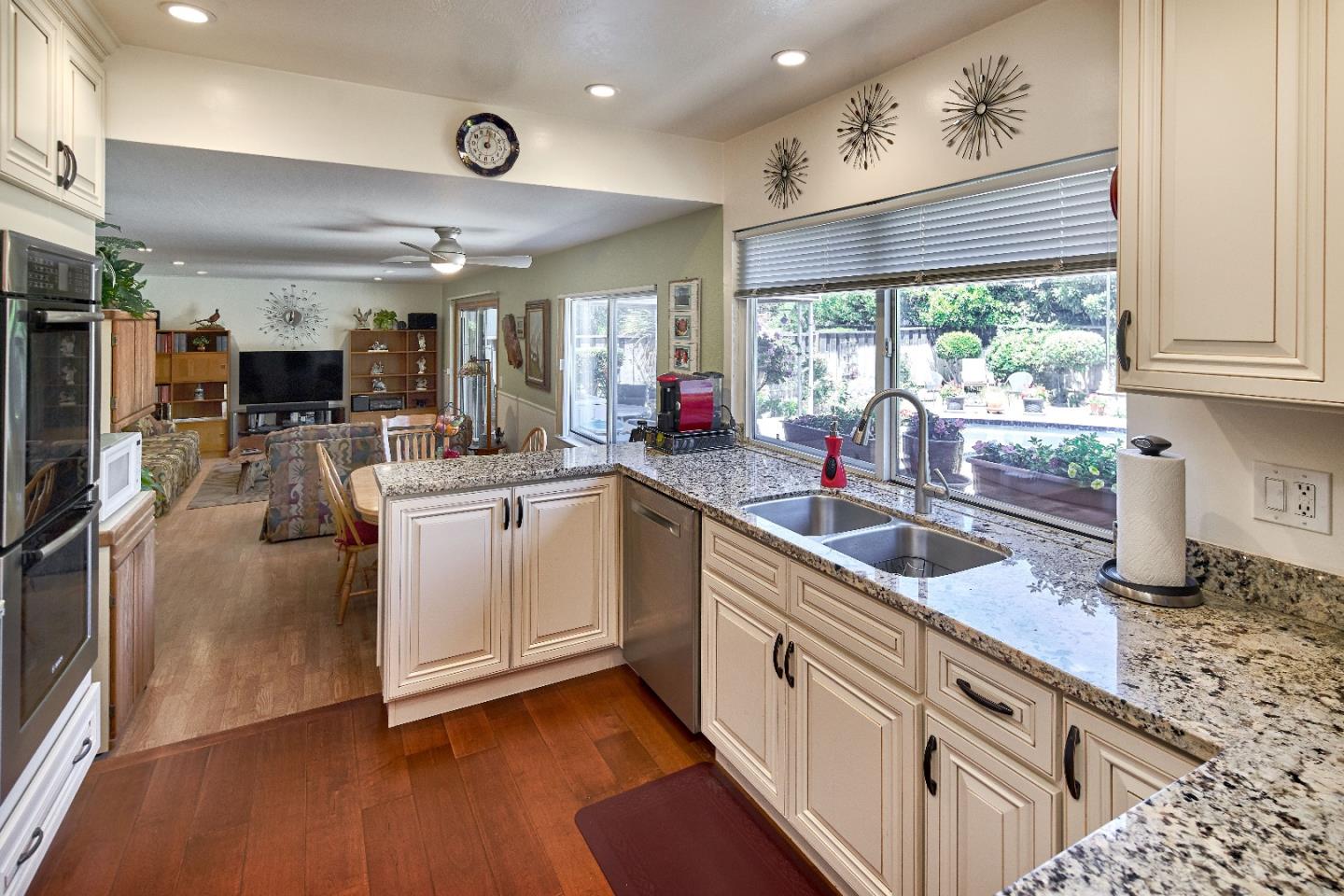 763 Upton Way San Jose, CA 95136 - Photo 10 of 32 a kitchen with stainless steel appliances granite countertop a lot of counter space and a window