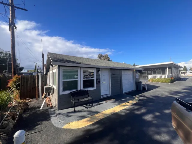 a view of a swimming pool with a yard