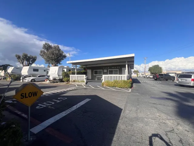 a view of a terrace with furniture and a yard