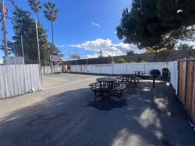 a view of a backyard with sitting area