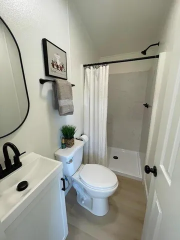 a view of a bathroom from a hallway