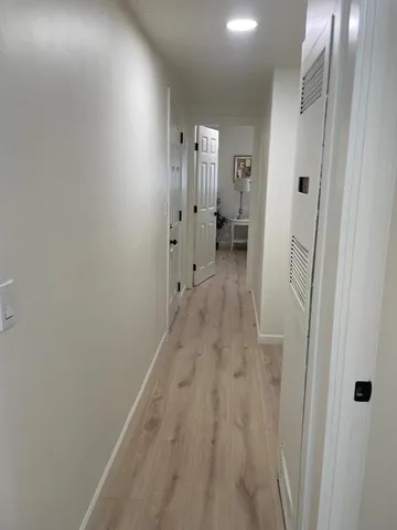 a bedroom with a bed and chair