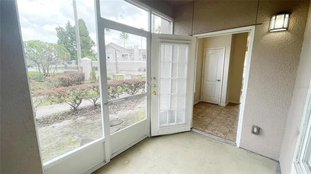 a view of an empty room and window