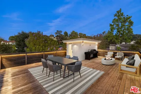 a view of a terrace with furniture