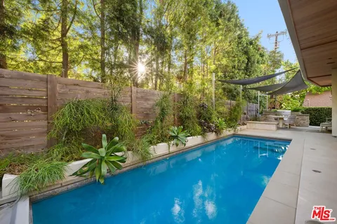 a view of swimming pool from a balcony