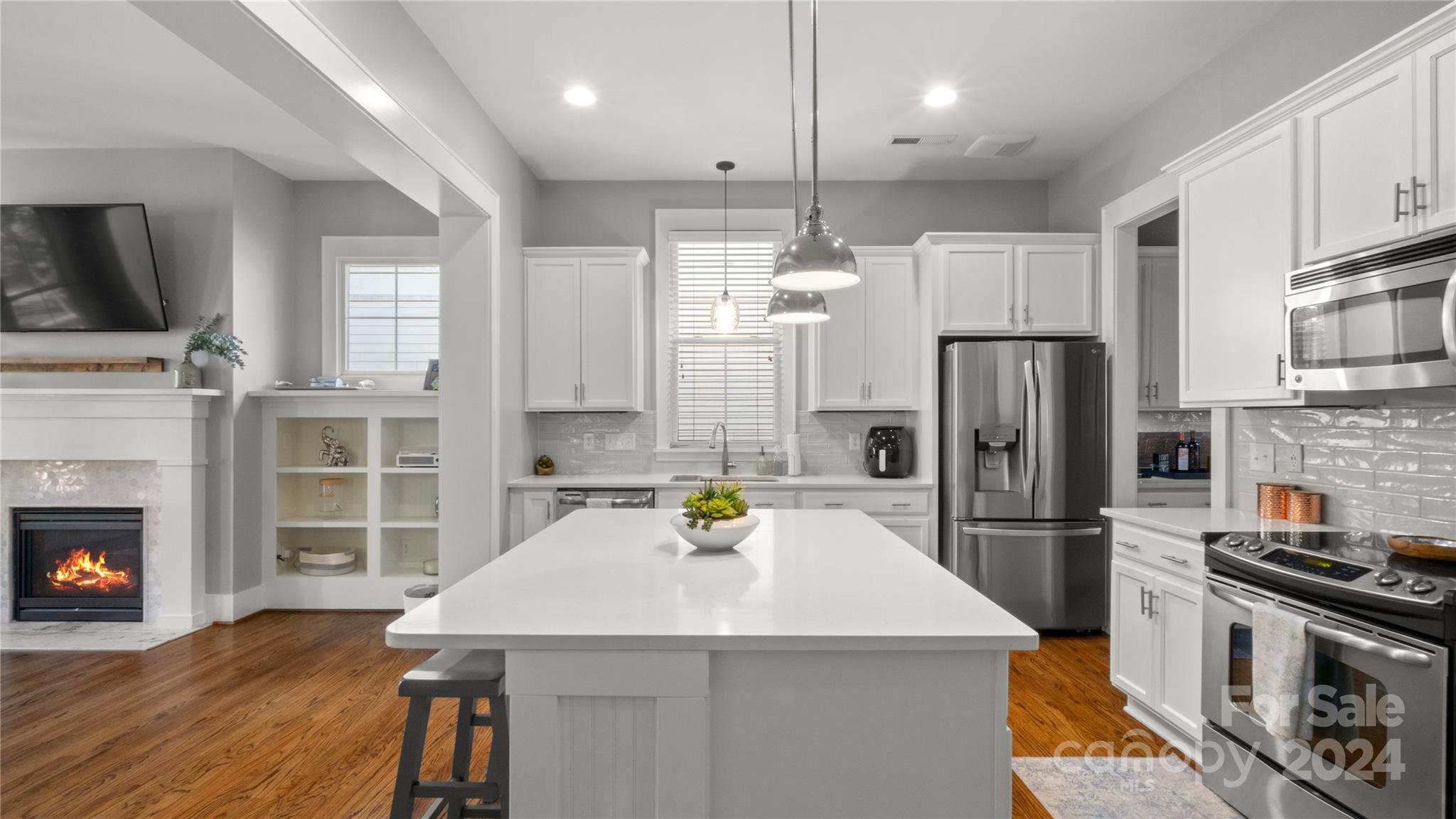 444 Hollyhock Lane Fort Mill, SC 29708 - Photo 13 of 30 a kitchen with stainless steel appliances a refrigerator sink and stove