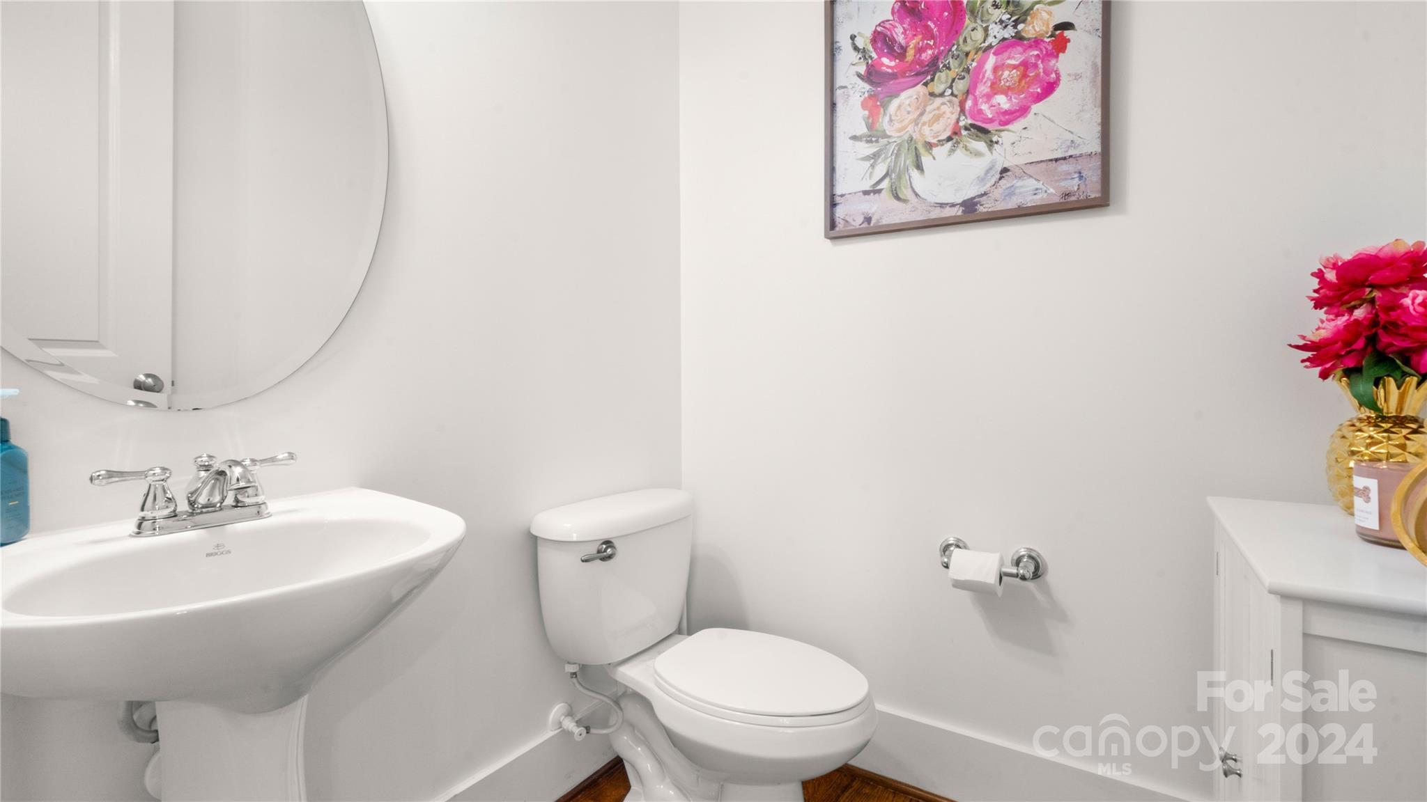 444 Hollyhock Lane Fort Mill, SC 29708 - Photo 7 of 30 a bathroom with a toilet a sink and a mirror
