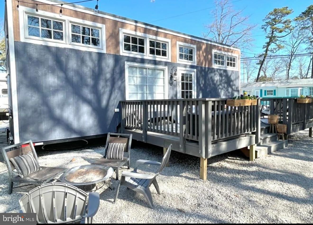 561 Corsons Tavern Road, Unit 43 Ocean View, NJ 08230 - Photo 3 of 18 a view of a patio with a table and chairs