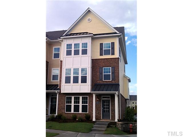 1311 Rodessa Run Raleigh, NC 27607 - Photo 1 of 4 a view of a white house next to a yard
