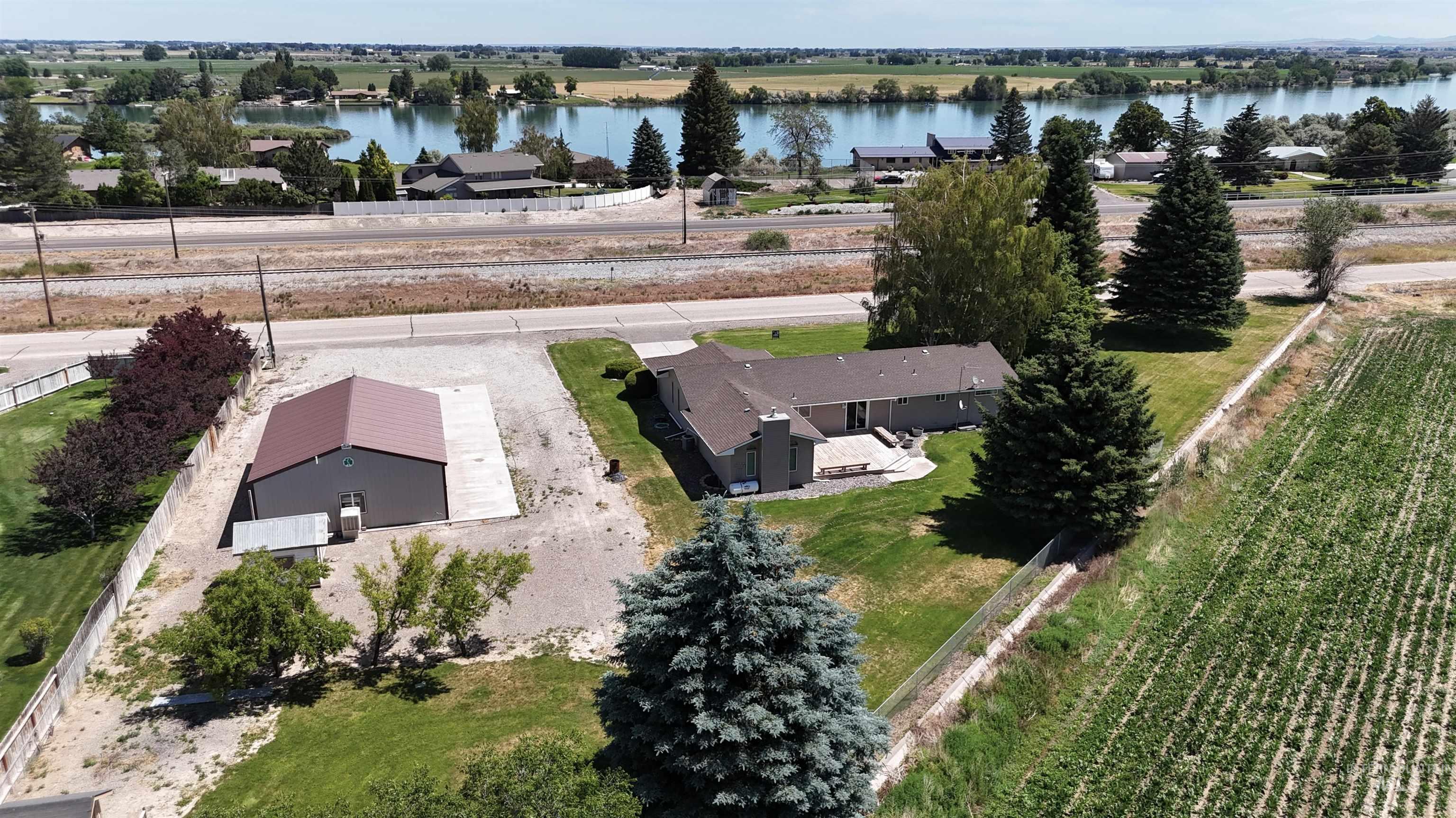 223 Hillcrest Road Burley, ID 83318 - Photo 5 of 28 Expansive property featuring a single-story residence and a detached metal-sided outbuilding with a brown roof