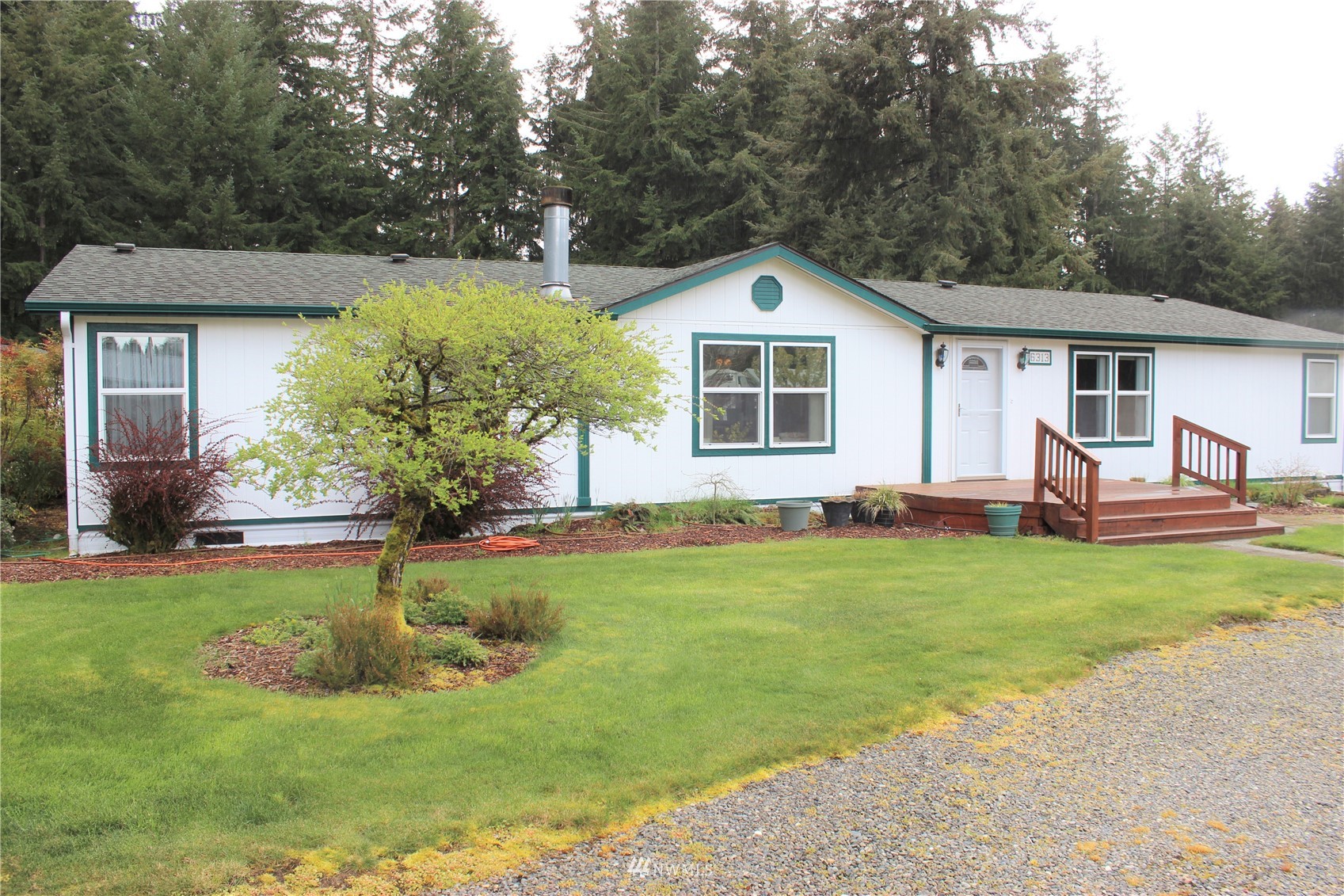 6313 190th Lane Southwest Rochester, WA 98579 - Photo 11 of 37 a front view of house with yard and green space