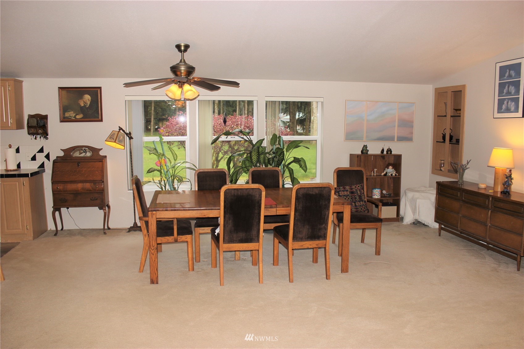 6313 190th Lane Southwest Rochester, WA 98579 - Photo 17 of 37 a dining room with furniture a chandelier and a flat screen tv
