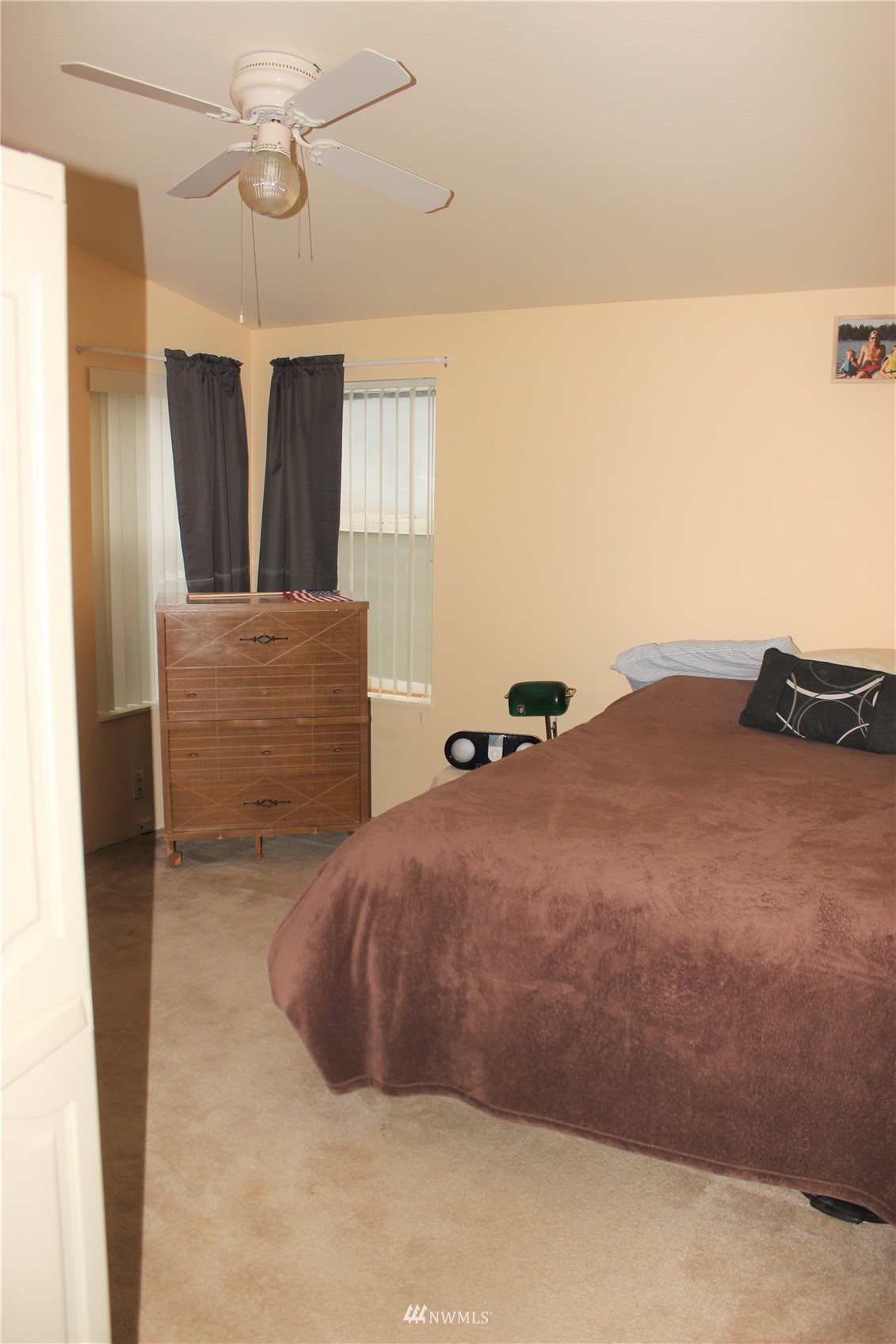 6313 190th Lane Southwest Rochester, WA 98579 - Photo 29 of 37 a bedroom with a bed and cabinets
