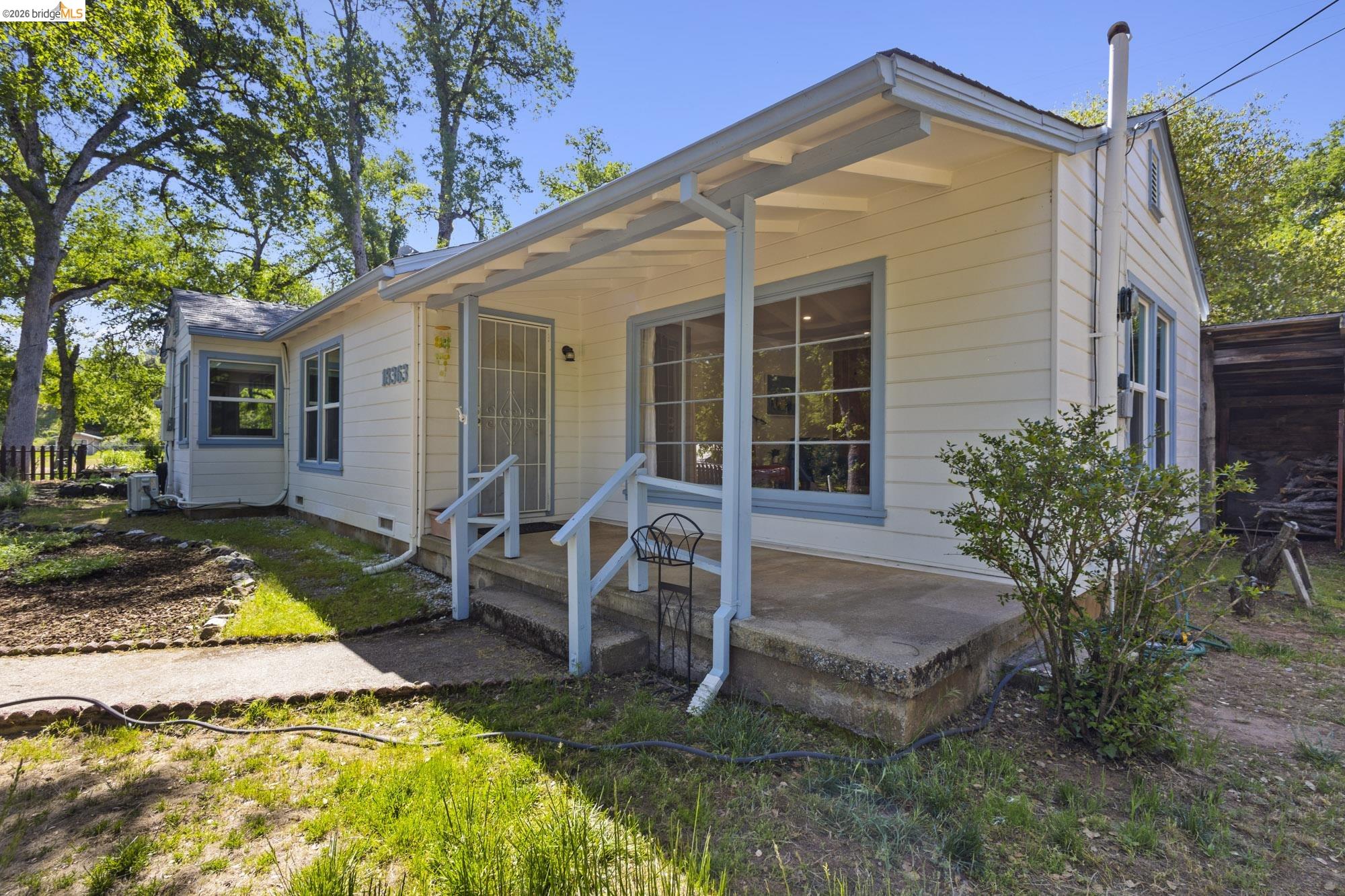 18363 Yosemite Road Tuolumne, CA 95379 - Photo 31 of 34 Charming single-story exterior with light-colored siding and contrasting trim