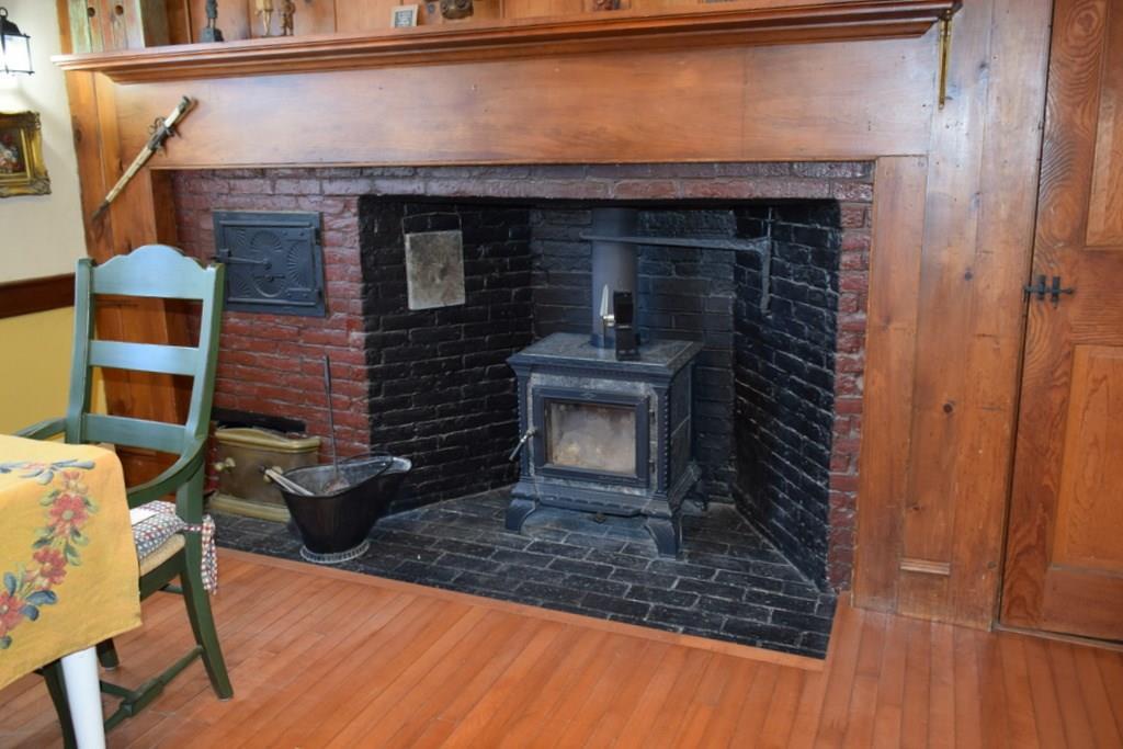 37 Nequasset Road Woolwich, ME 04579 - Photo 11 of 25 Hearth and woodstove accenting the...