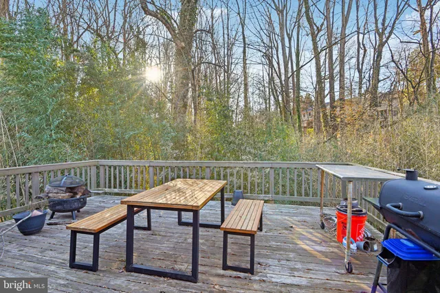 a room with a wooden floor and a tub