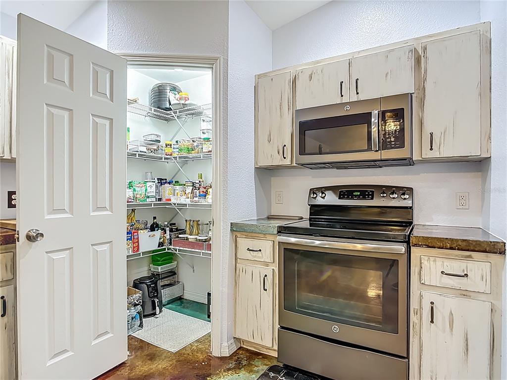 3114 Southeast Brown Road Arcadia, FL 34266 - Photo 19 of 61 a kitchen with cabinets and steel appliances