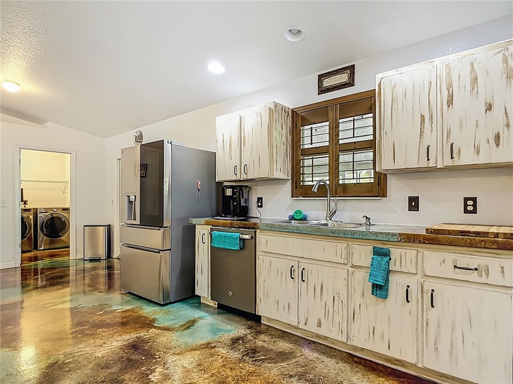 3114 Southeast Brown Road Arcadia, FL 34266 - Photo 21 of 61 a kitchen with white cabinets and white appliances