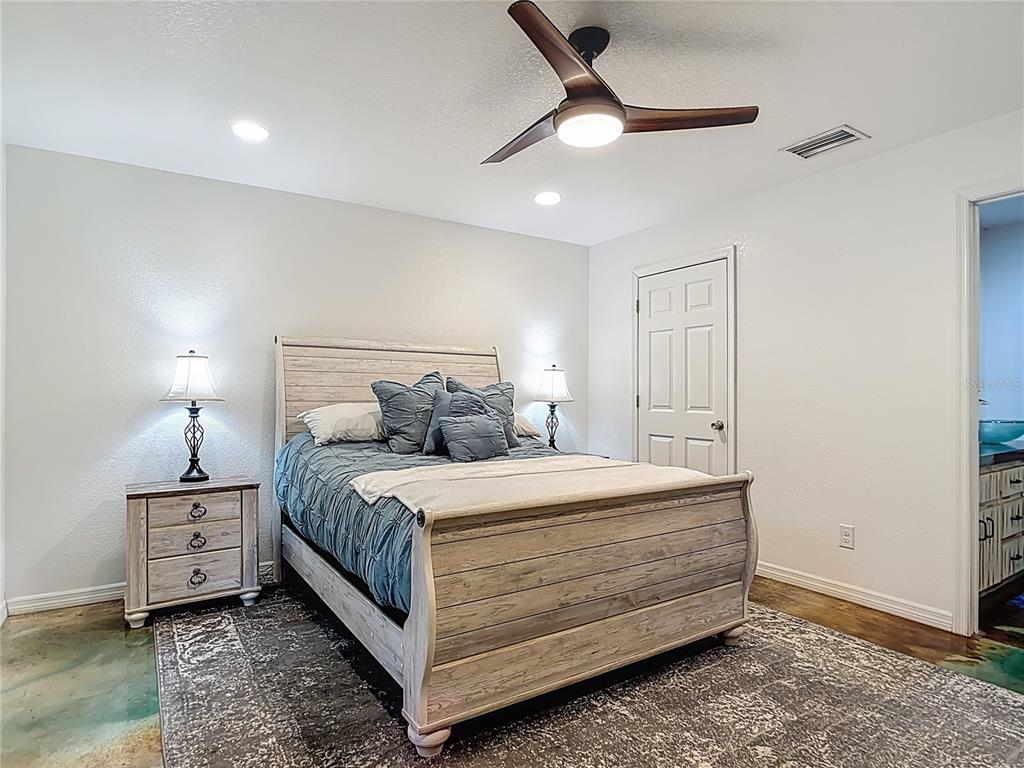 3114 Southeast Brown Road Arcadia, FL 34266 - Photo 25 of 61 a bedroom with a bed chandelier and a window